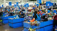 Walmart cuts starting hourly pay for some workers