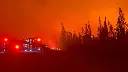 Hundreds of wildfires raging in Canada’s Northwest Territories prompt evacuations in what officials are calling a ‘crisis situation’