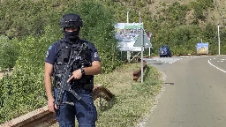 Masked gunmen attack Kosovo police and kill 1 officer in an escalation of tensions with Serbia