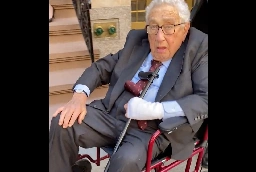 WATCH: Reporter Confronts Wheelchair-Bound Kissinger About His Support For ‘Alleged War Crimes’