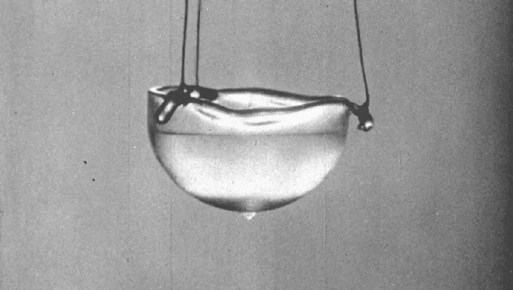 A grainy still image of superfluid helium