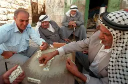 Palestinian men playing dominoes in the West Bank, 1996 - Lemmy.World