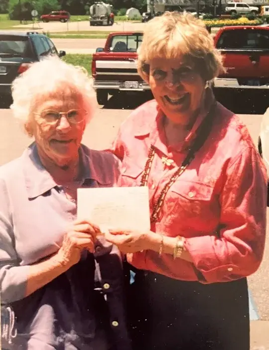 Kroger, left, and DeReamer with the card in 2005. (Courtesy of Don Kroger)