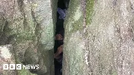 Woman wedged in boulders after trying to reach lost phone is rescued