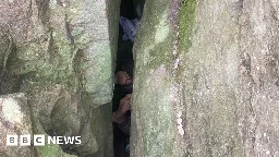 Australia woman rescued after getting stuck upside down between boulders