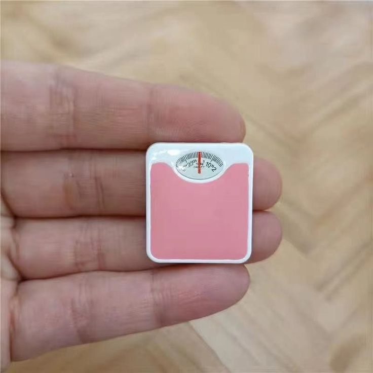 bathroom scale white with pink foot area