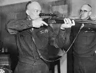 General Eisenhower with a German over-under combination rifle/shotgun with a scope, General Omar Bradley looks on, Europe, WW2, 1945