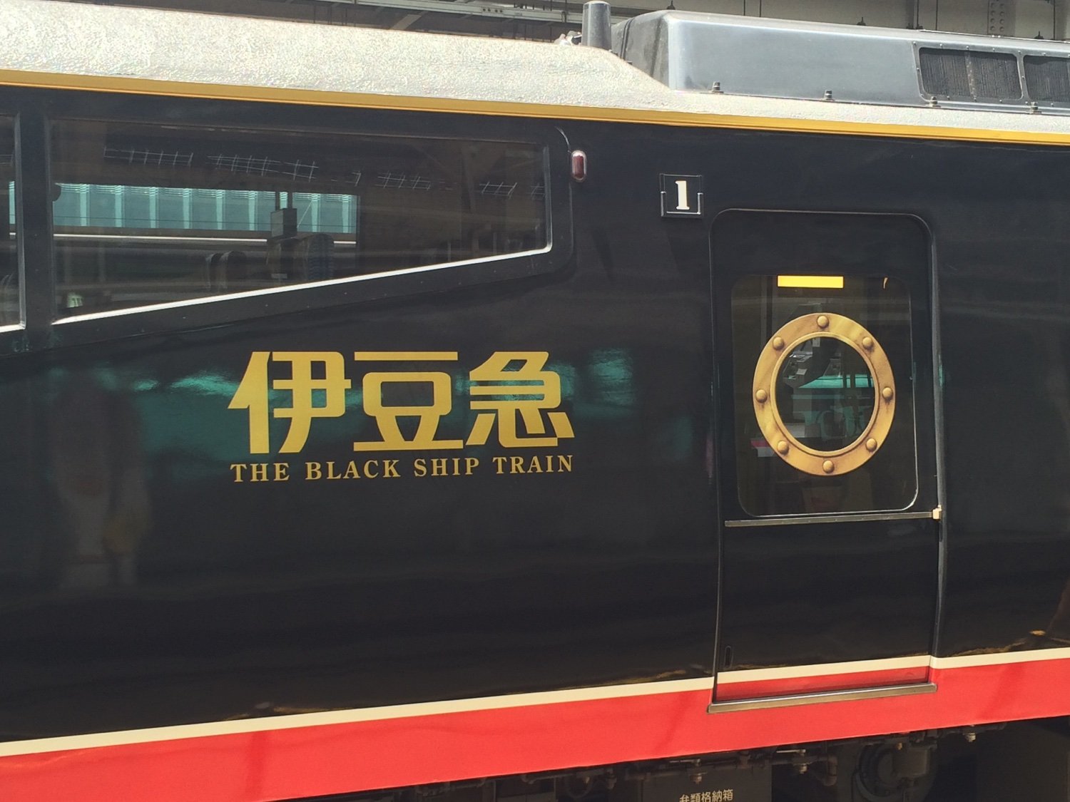 The side of The Black Ship Train which features a porthole painted onto the window as part of the Western sailing ship motif.