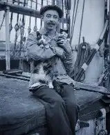 Sailor with the ship cat and her kitten, ~1910