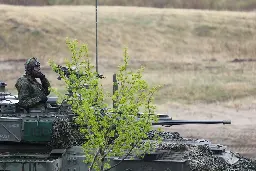 Canadian soldier keeps a watchful eye from a LAV III during training exercise. Alberta, Canada, May 15, 2019. [1000x667]