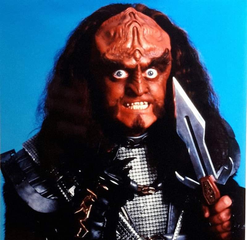 Gowron holds up a knife and gives the Gowron eyes