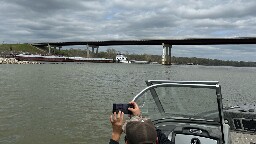 Oklahoma State Patrol says it is diverting traffic after a barge hit a bridge