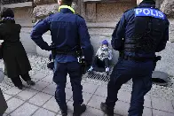 Greta Thunberg dragged by police from climate protest blocking Swedish parliament