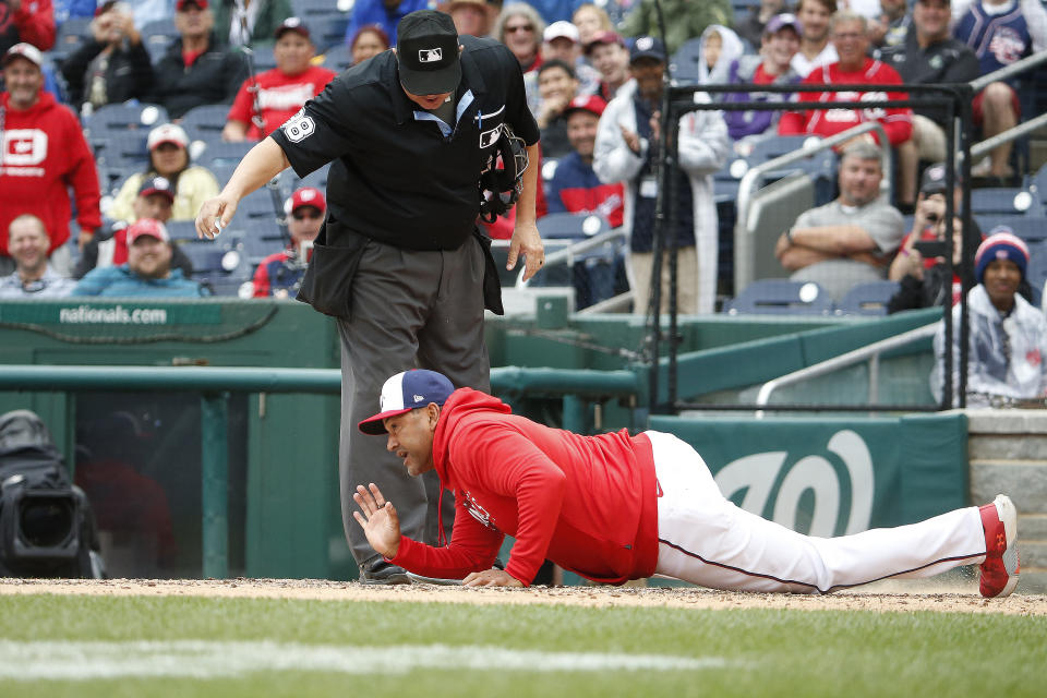 Nationals manager Dave Martinez ejected, drops to the dirt while arguing with umpire in loss to Diamondbacks