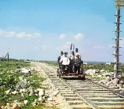 Russian handcar, 1916? Photographer posing on the seat to the right