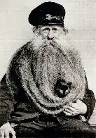 Louis Coulon, trade unionist, with a cat in his 10-foot long beard, France, 1890