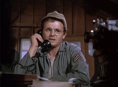 Radar from MASH talking on the phone