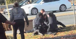 Video Shows Officer Repeatedly Punching Woman Held on Ground