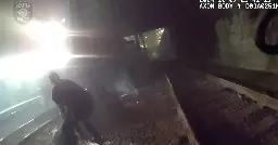 Video shows Seattle police pull injured man from tracks just seconds ahead of oncoming train