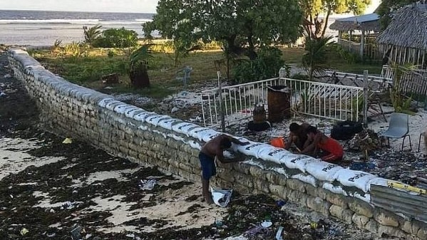 Rising sea levels were beginning to swallow Teaote's home on Kiribati — so she built a seawall - ABC Pacific