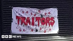 Remembrance Sunday: 'Traitors' banner put up at Michelle O'Neill's office