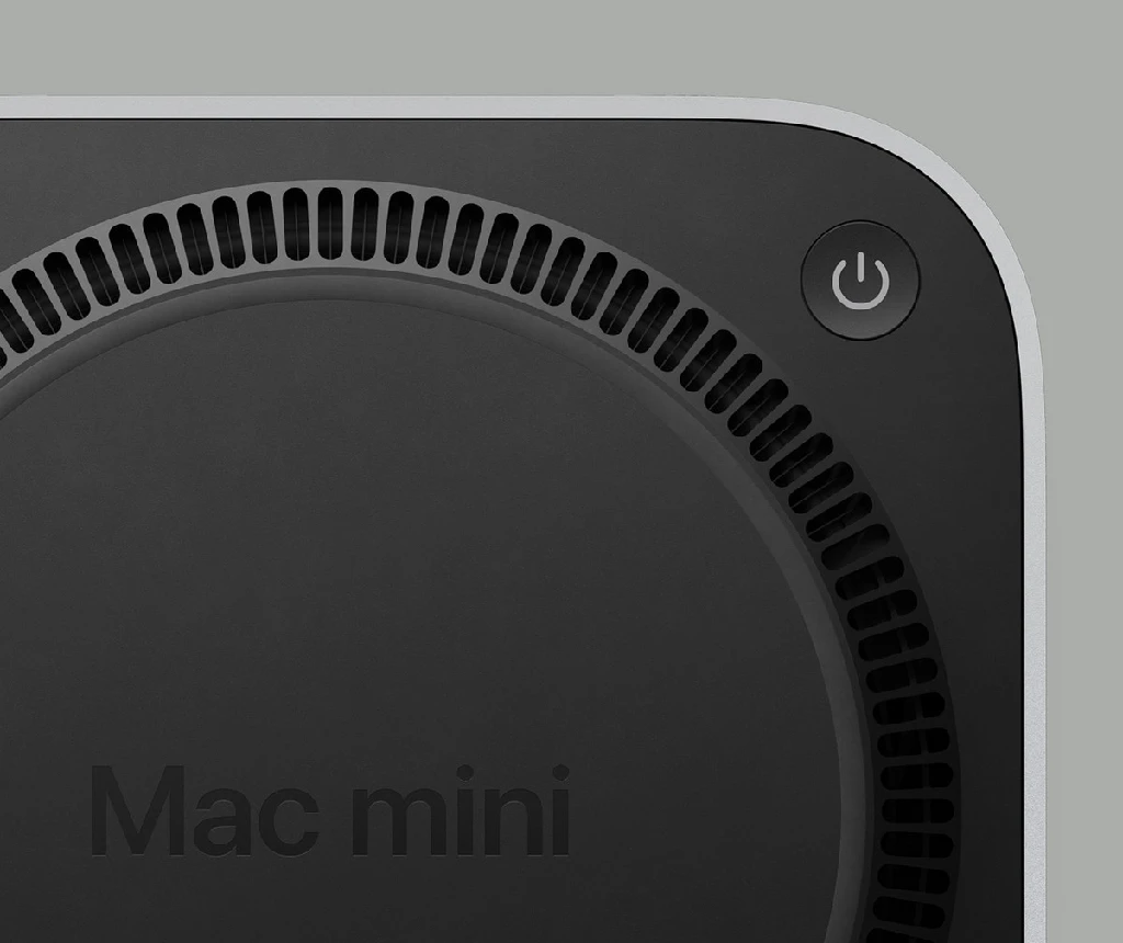 A Mac Mini underside, showing the power button placement.