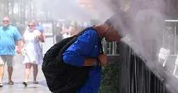 U.S. hit by blazing heat, smoky air, tropical storm all at once