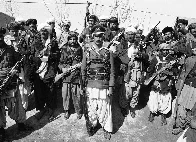 Afghan Army defector poses with Mujahedeen against the Soviet invasion, 1980