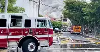 Massive fire breaks out at Miami apartment building, employee of building found shot at scene