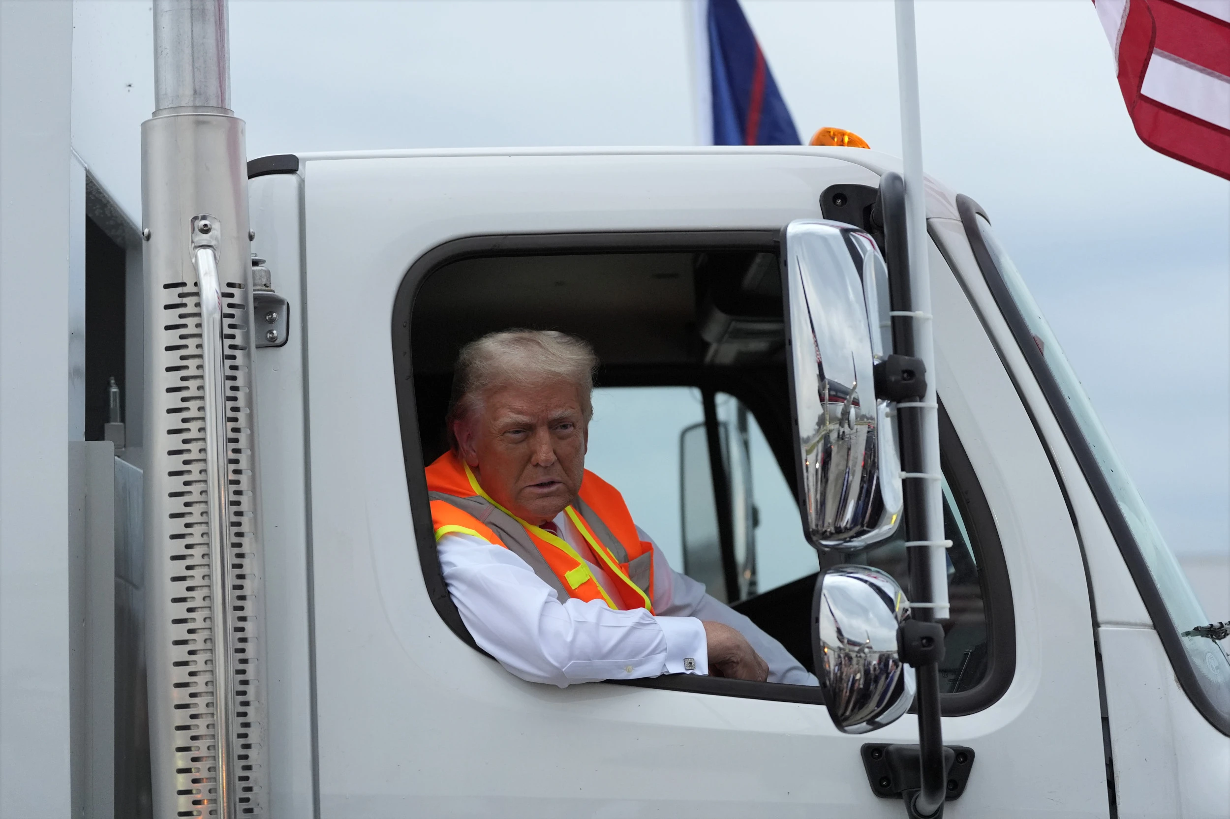 Trump rides garbage truck to hammer Biden as Harris scrambles to clean up