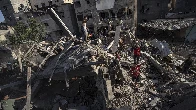 Warplanes strike Gaza refugee camp as Israel rejects US push for a pause in fighting