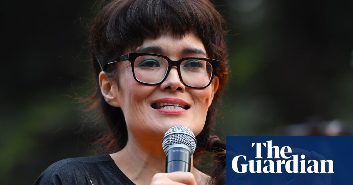 Man charged for alleged harassment of Yumi Stynes, who has received threats over sex education book