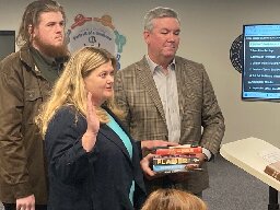 Newly elected school board president sworn in on stack of banned books