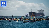 More than 100 arrested during anti-coal protest in Newcastle Harbour as shipping movements paused