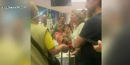 Passengers were stuck on plane for 7 hours with no air conditioning, no food or water provided, woman says