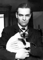 Yuri Knorozov, Soviet linguist who was instrumental in decoding Mayan script, holding his co-author, Asya, 1980s?