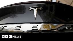 Tesla profits cut in half as demand falls