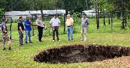 A Florida sinkhole that killed a man in 2013 opens for a third time