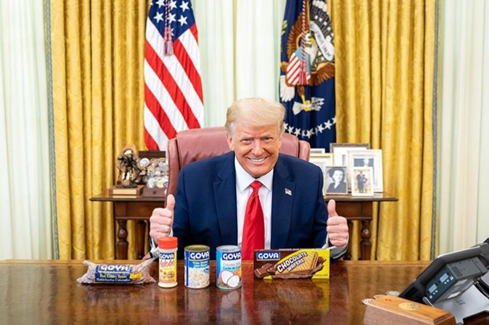 the orange idiot selling beans from the oval