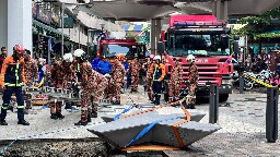 Woman from India disappears down a sinkhole in Malaysia's capital